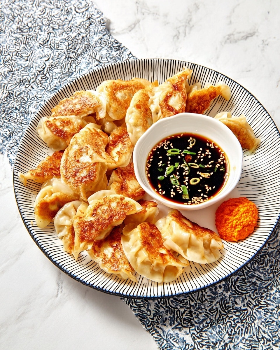 A white plate with a black grid pattern holds two layers of golden-brown dumplings, some with crispy pan-fried sides showing a slightly darker orange-brown texture, and others softer and lighter in color with smooth, slightly shiny wrappers. In the top left of the plate, there is a small white bowl filled with dark soy sauce sprinkled with white sesame seeds and sliced green chilies floating on top. Above the plate, a woman's hand uses black chopsticks to hold one half-eaten dumpling, revealing a soft orange filling inside. The scene is set on a white marbled surface with a black and white checkered cloth partially under the plate. photo taken with an iphone --ar 4:5 --v 7
