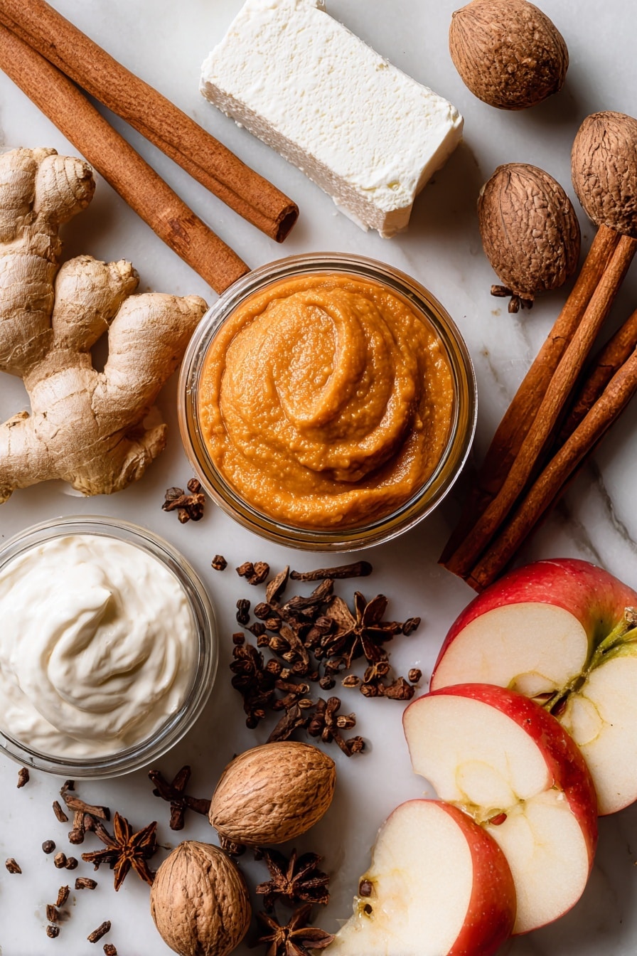 Flat lay of a smooth pumpkin puree in a rich orange hue, a block of creamy white cream cheese with a soft texture, a glossy jar of fluffy white marshmallow cream, warm brown cinnamon sticks, whole nutmeg pods with their rough, brown shells, golden ginger roots with knobby texture, dark brown cloves scattered delicately, and crisp red apple slices with glistening skin, all naturally arranged in a balanced composition showing off vibrant colors and textures, placed on white marbled surface, photo taken with an iphone --ar 2:3 --v 7 - Creamy Pumpkin Dip, fall appetizer, pumpkin dip recipe, easy pumpkin dip, holiday party dips