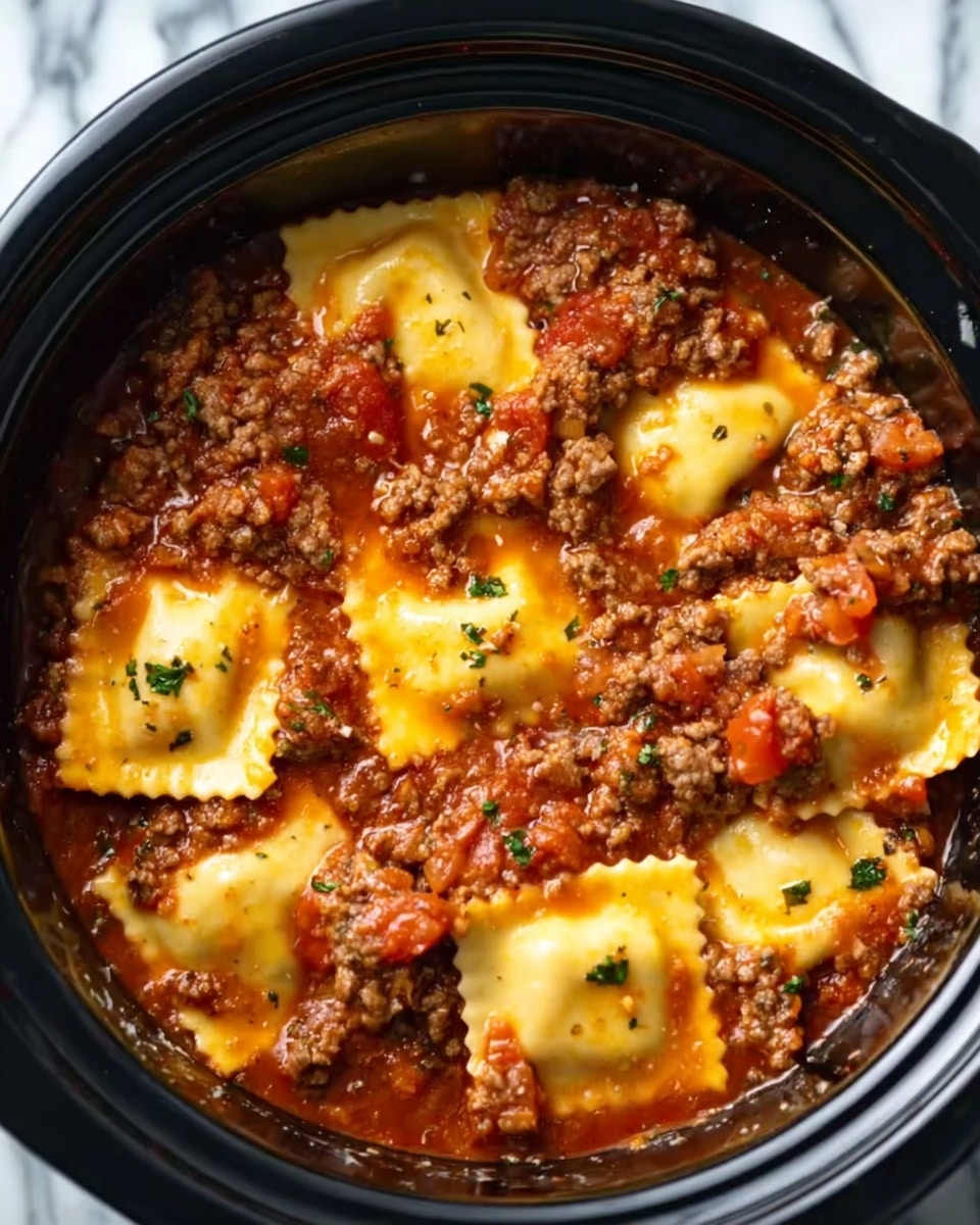 The image shows a white bowl filled with a thick, rich tomato sauce mixed with small brown ground meat pieces. Floating on top are seven large, golden-yellow ravioli squares with slightly browned edges. Some black pepper is sprinkled on the ravioli. The bowl is placed on a white marbled surface. Photo taken with an iphone --ar 4:5 --v 7