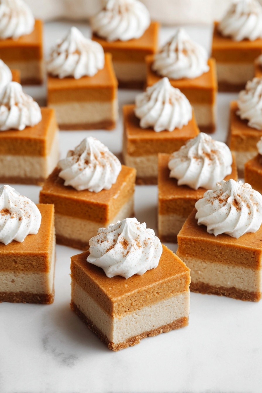 The image shows many small square dessert bars arranged on a white marbled surface. Each bar has two layers: a lighter beige bottom layer that looks firm, and a thicker top layer of smooth, orange-brown color. On top of each bar is a swirl of white whipped cream with a small sprinkle of brown spice, centered on the orange layer. The bars are evenly spaced and appear soft and moist. Photo taken with an iphone --ar 2:3 --v 7 - Pumpkin Pie Bars with Shortbread Crust and Whipped Cream, pumpkin dessert bars, easy pumpkin pie bars, homemade pumpkin treat, fall dessert recipes