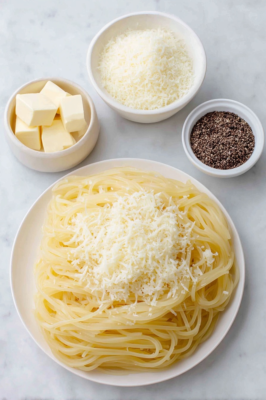 Flat lay of dried bucatini pasta nest, two tablespoons of unsalted butter in a small white ceramic bowl, half cup of freshly grated Pecorino Romano cheese in a simple white plate, cracked black peppercorns scattered neatly beside a small white bowl containing toasted cracked black pepper, placed on a clean white marble surface, soft natural light, photo taken with an iPhone, professional food photography style, fresh ingredients, white ceramic bowls, no bottles, no duplicates, no utensils, no packaging --ar 2:3 --v 7 --p m7354615311229779997 - Cacio e Pepe Pasta, Cacio e Pepe, simple Roman pasta, creamy black pepper pasta, quick Italian pasta recipes
