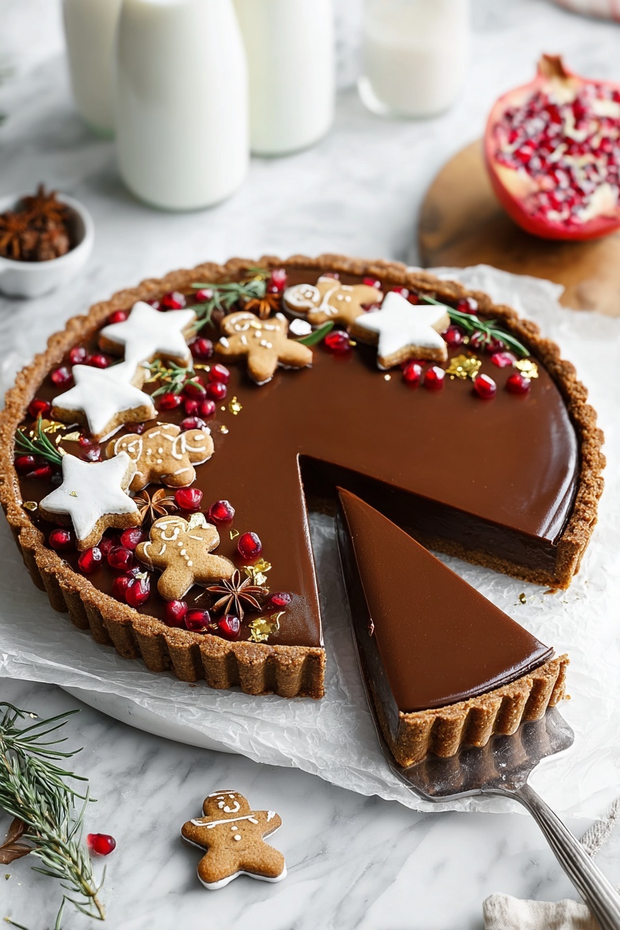 A round tart with a brown crust and a smooth, shiny dark chocolate filling sits on a white marbled surface lined with white paper. Three slices are cut and partly lifted with a spatula showing the thick layers of crust and creamy chocolate inside. The top edge of the tart is decorated with white star-shaped cookies, small gingerbread men with white icing, brown star anise pieces, fresh green rosemary sprigs, scattered shiny red pomegranate seeds, and small gold leaf pieces. Two glass bottles of milk are blurred in the background on the white marbled surface. A partially opened pomegranate on a wooden board is also visible. Photo taken with an iphone --ar 2:3 --v 7 - Vegan Gingerbread Chocolate Tart, vegan gingerbread dessert, holiday chocolate tart, festive vegan dessert, gluten-free gingerbread tart