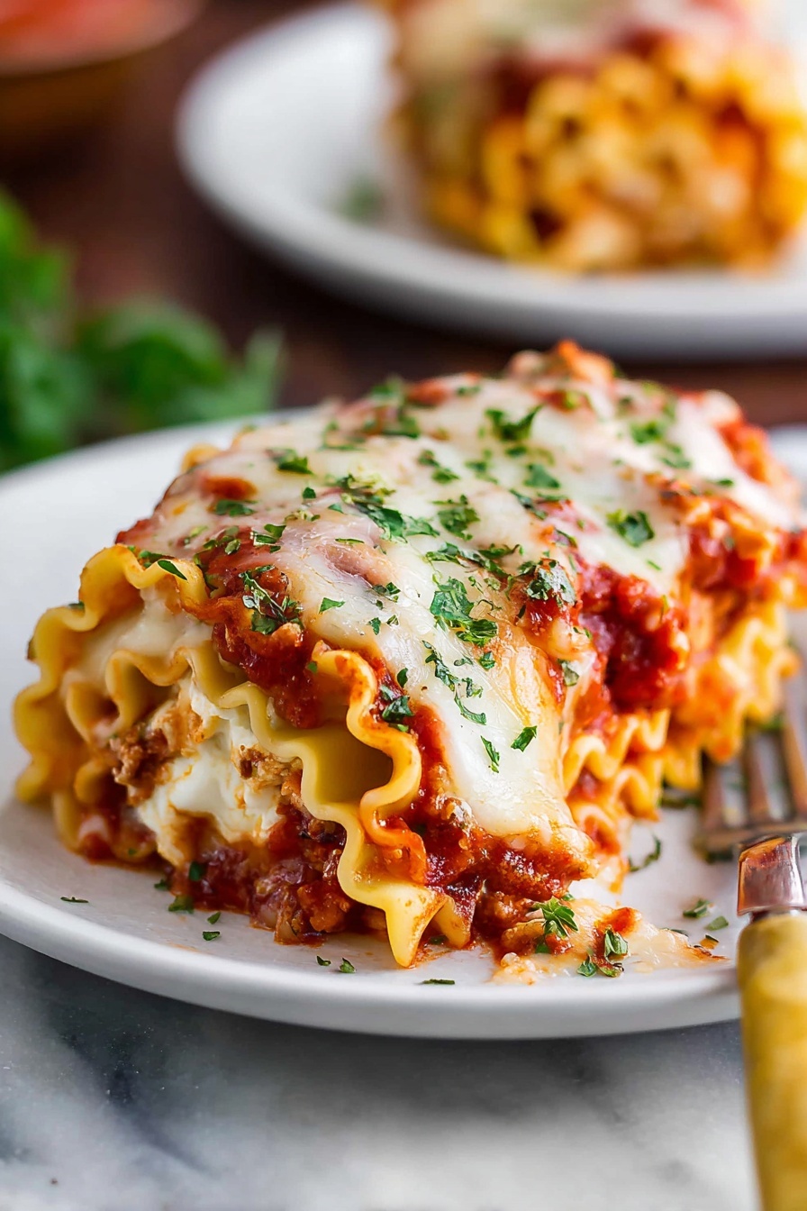 A white rectangular baking dish holds a freshly baked layered lasagna with a thick top layer of melted cheese browned unevenly with golden and white spots. The surface is sprinkled with small green herb leaves. The lasagna appears rich and textured, with visible layers of savory sauce under the cheese. The dish sits on a smooth white marbled surface. photo taken with an iphone --ar 2:3 --v 7 - Cheesy Beef Lasagna Roll-Ups, cheesy beef lasagna roll-ups, Italian lasagna roll-ups, easy beef and cheese roll-ups, homemade lasagna roll-ups