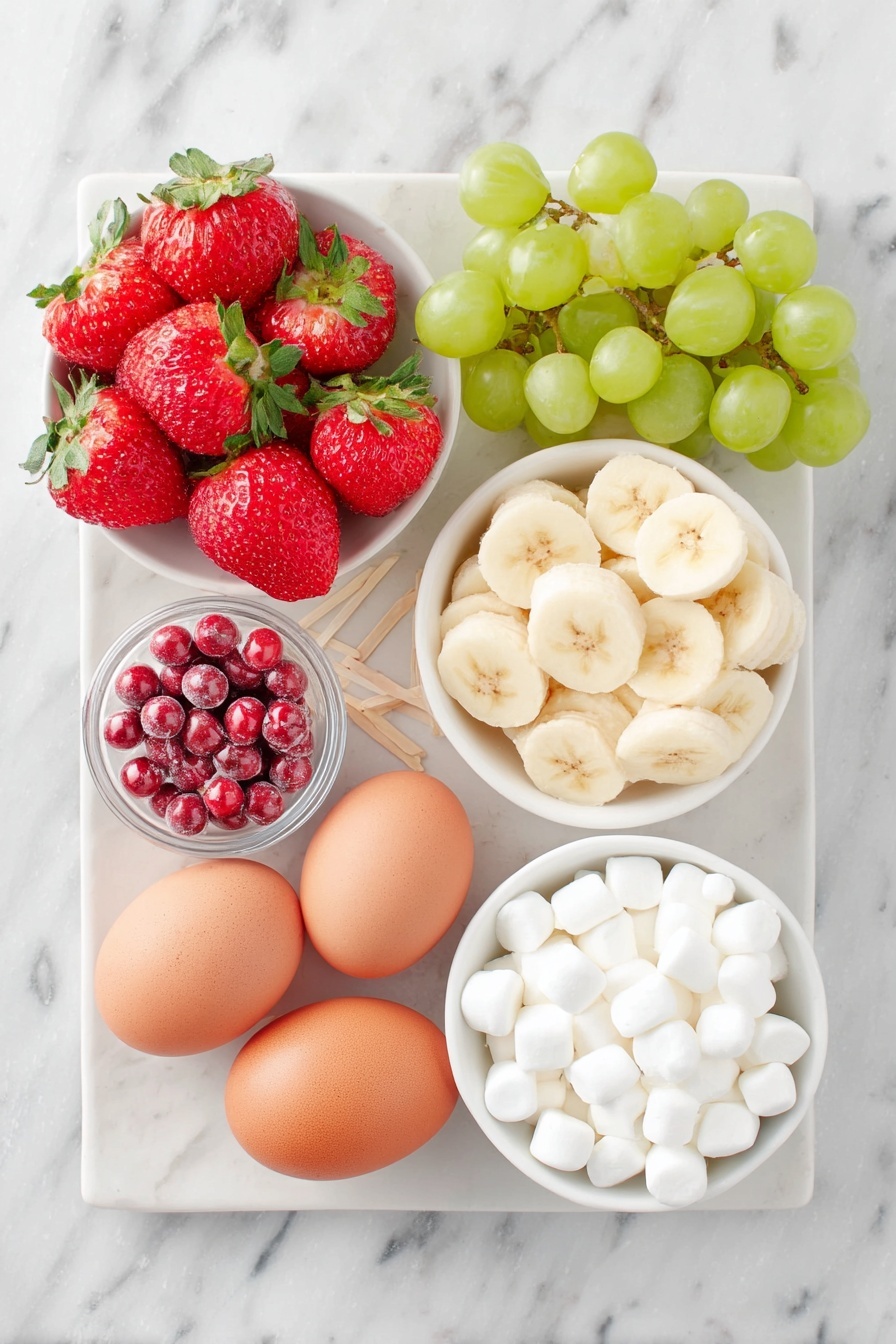Flat lay of a small cluster of bright red strawberries with green leafy tops, a handful of shiny green grapes, a peeled banana sliced into thin rounds arranged neatly, a few small white mini marshmallows in a small simple white ceramic bowl, two whole uncracked brown eggs (note: no eggs in this recipe so omit), a small white ceramic bowl filled with small round red candies, another small white bowl holding tiny candy eyes, all arranged symmetrically on a clean white ceramic plate with toothpicks neatly placed beside them, placed on a clean white marble surface, soft natural light, photo taken with an iPhone, professional food photography style, fresh ingredients, white ceramic bowls, no bottles, no duplicates, no utensils, no packaging --ar 2:3 --v 7 --p m7354615311229779997 - Festive Fruit Kabobs, holiday fruit skewers, Christmas fruit snacks, colorful fruit party appetizers, easy holiday fruit recipe