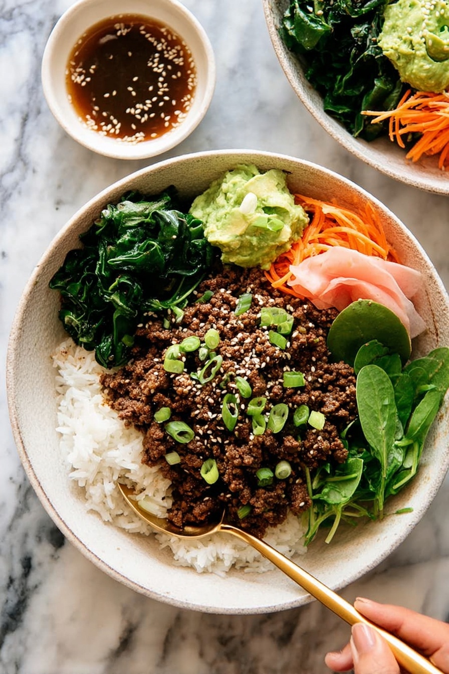 The dish is served in a white bowl filled with three main layers: at the bottom is a bed of white rice mixed with small green vegetables and thin orange carrot strips, on top is a layer of crumbly cooked brown ground meat, and on one side there are fresh green leafy lettuce and soft pink pickled ginger slices. In the center of the bowl, a small dollop of green mashed avocado is sprinkled with white sesame seeds and chopped green onions. A gold spoon rests inside the bowl against the edge, and the bowl sits on a white marbled surface next to a white cloth napkin. Photo taken with an iphone --ar 2:3 --v 7 - Korean Beef Bulgogi Rice Bowls, Korean beef bulgogi recipe, bulgogi rice bowl, Korean beef bowls, easy Korean beef recipes
