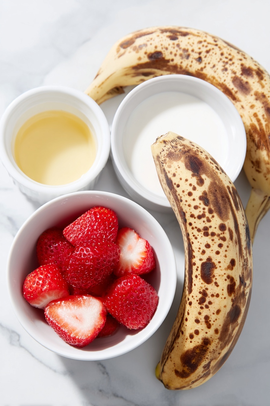 Flat lay of peeled ripe bananas with brown spots, bright red frozen strawberries, a small white ceramic bowl of pale vanilla extract, a small white ceramic bowl of creamy non-dairy milk, placed on a clean white marble surface, soft natural light, photo taken with an iPhone, professional food photography style, fresh ingredients, white ceramic bowls, no bottles, no duplicates, no utensils, no packaging --ar 2:3 --v 7 --p m7354615311229779997 - Strawberry Banana Smoothie Bowl, healthy breakfast recipes, easy smoothie bowl, fruit smoothie bowl, quick breakfast ideas