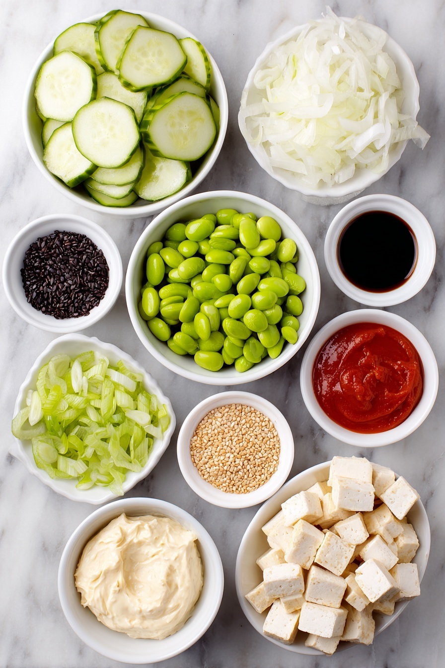 Flat lay of a whole fresh cucumber sliced into thin rounds, a small white ceramic bowl of thinly sliced white onion, a generous handful of golden crispy baked tofu cubes, a small white bowl filled with shelled bright green edamame, a white bowl with thin julienned orange carrot sticks, a small pile of sliced green spring onion, neatly cubed half avocado with vibrant green flesh, a small white bowl containing creamy vegan cream cheese, another small white bowl holding smooth vegan mayo, a small white bowl with bright red Sriracha sauce, a tiny white bowl filled with glossy chili-crisp oil, a small white bowl of dark soy sauce, a small white bowl scattered with light tan sesame seeds, and a small white bowl with delicate dark green crushed nori flakes, all perfectly arranged in balanced symmetry on a clean white marble surface, soft natural light, photo taken with an iPhone, professional food photography style, fresh ingredients, white ceramic bowls, no bottles, no duplicates, no utensils, no packaging --ar 2:3 --v 7 --p m7354615311229779997 - Creamy Asian Cucumber Salad Bowl, Asian cucumber salad, quick Asian salad, healthy cucumber bowl, vegetarian Asian side dish